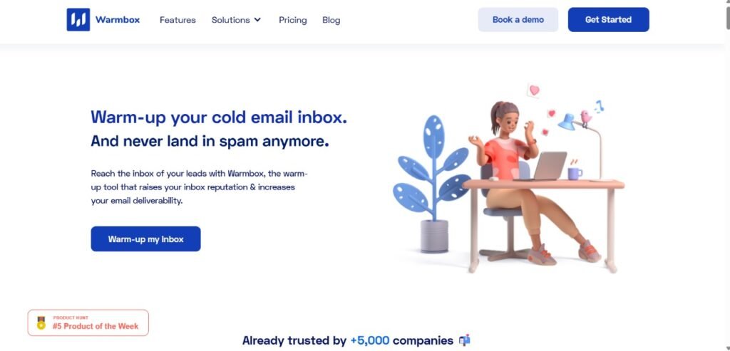 Warmbox homepage featuring the headline 'Warm-up your cold email inbox. And never land in spam anymore.' Subtext emphasizes improving inbox reputation and email deliverability. Includes a 'Warm-up my Inbox' button and visuals of a person working at a desk with floating email icons. Trusted by over 5,000 companies badge is displayed